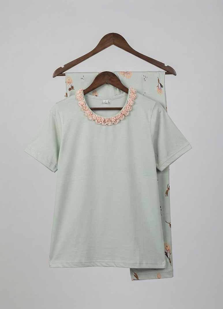 Women's sage green pajama set with lace collar top and floral print pants