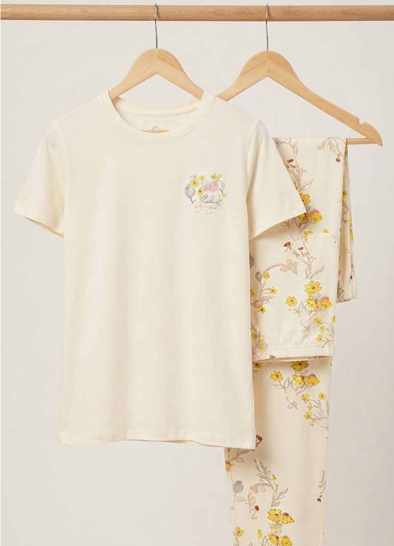 Women's cream pajama set with floral chest print top and floral print pants
