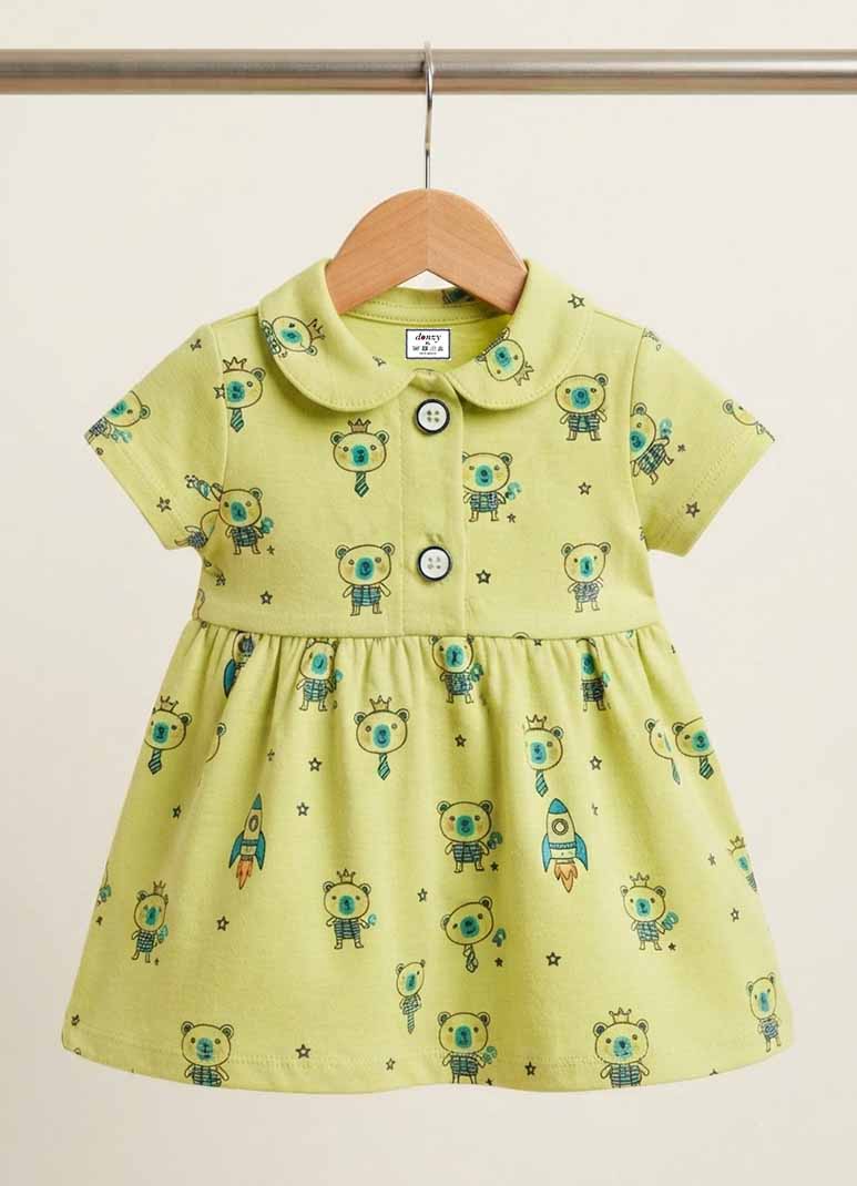 Girls green cotton frock with teddy bear and rocket print